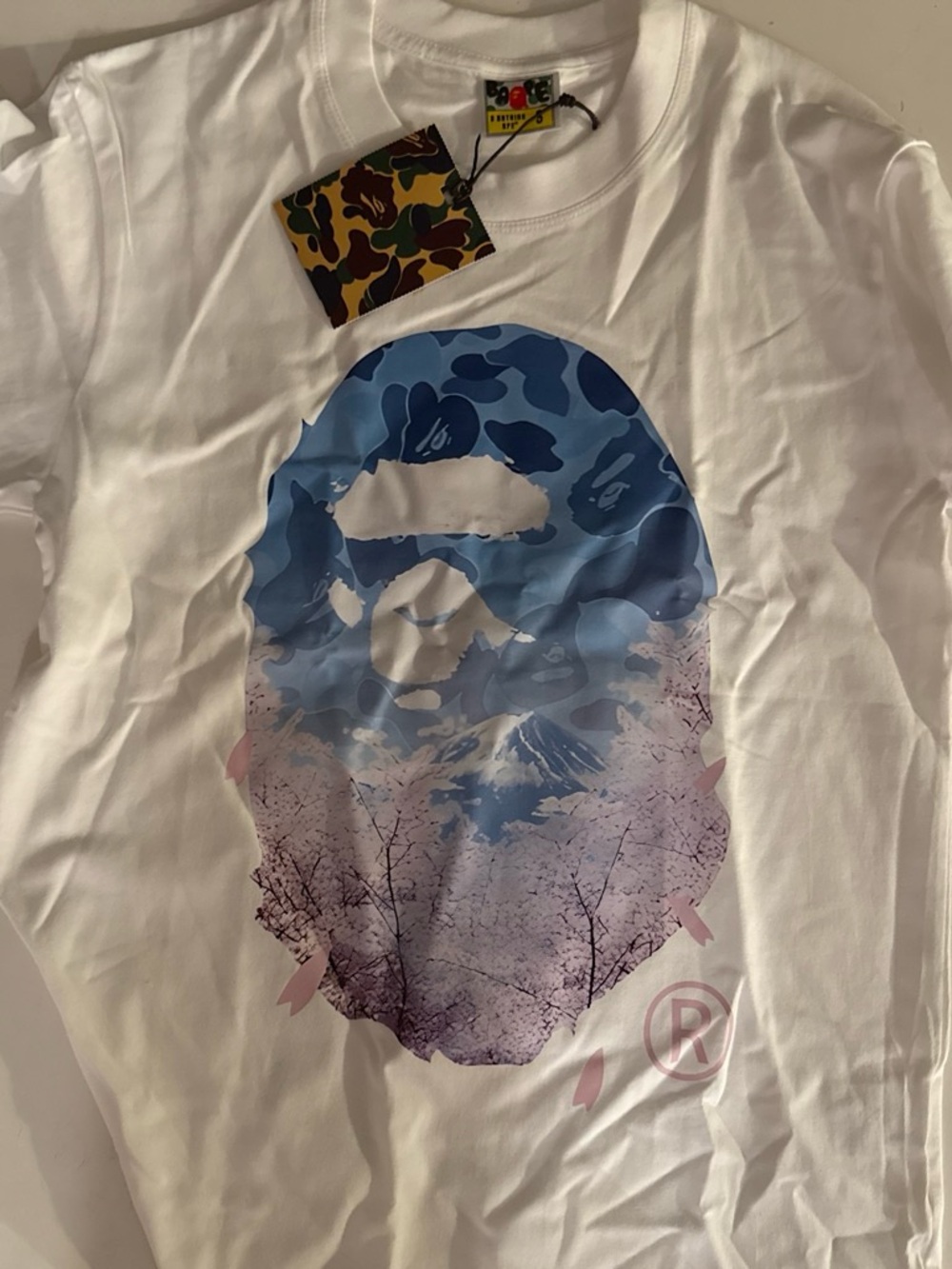 White Graphic Logo Tee with Blue & Pink Camouflage blossom tree Print